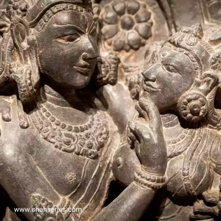 The photo is of a Shiv Parvati images. It is a sculpture made of stone carving and is likely an artifact found in a temple.
