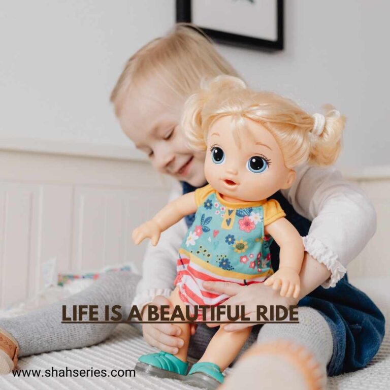 baby girl holds doll