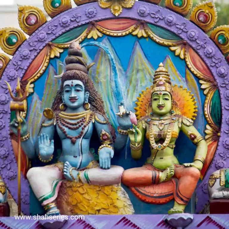 The photo is a group of Lord Shiva and Goddess Parvati in an outdoor setting. The Lord Shiva and Goddess Parvati are located at a temple or shrine. The Lord Shiva and Goddess Parvati are beautifully carved and the place is used for meditation and worship.